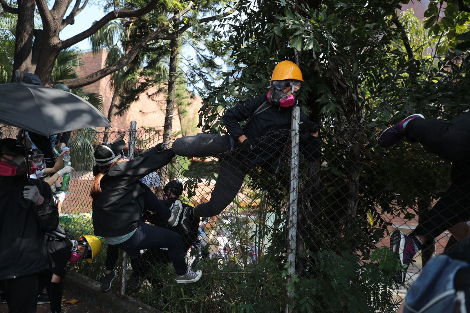 Protesters attempt to escape Polytechnic University. Photo: Sam Tsang
