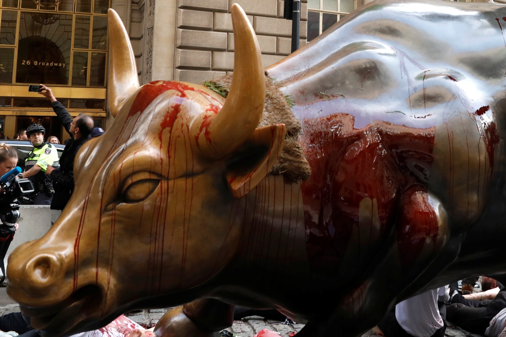 Wall Street Bull Splattered In Fake Blood As Extinction Rebellion