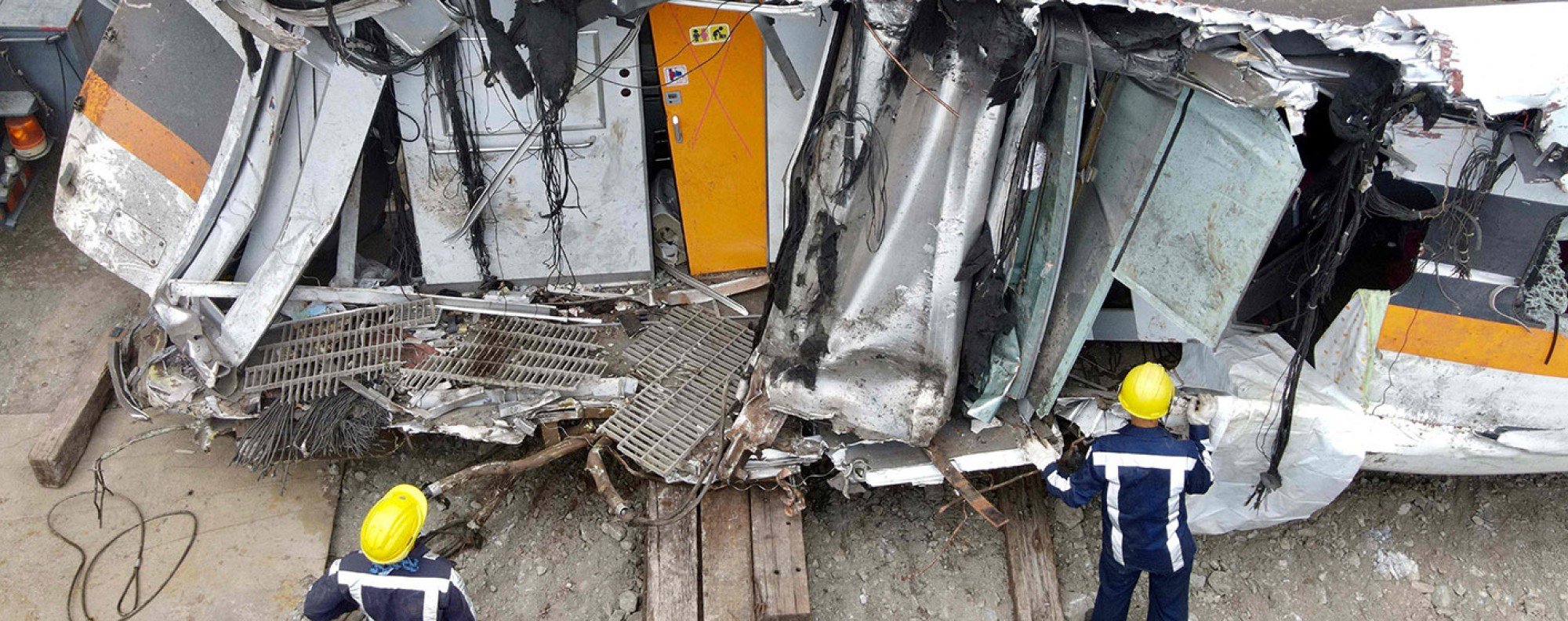 Workers checking damaged carriages at the site of Taiwan’s worst train accident in decades. Photo: AFP