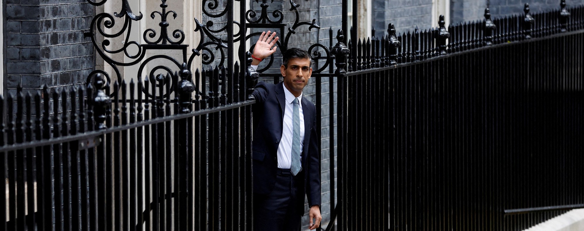 New leader of Britain's Conservative Party Rishi Sunak walks outside the Conservative Campaign Headquarters, in London. Photo: Reuters