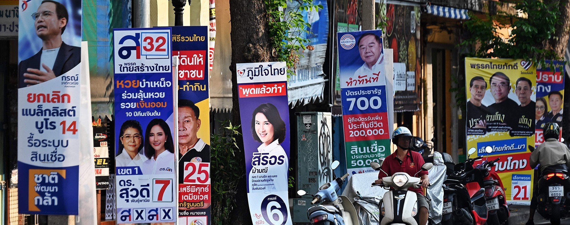 Campaign posters for this year’s general election line a street in Bangkok. Photo: AFP
