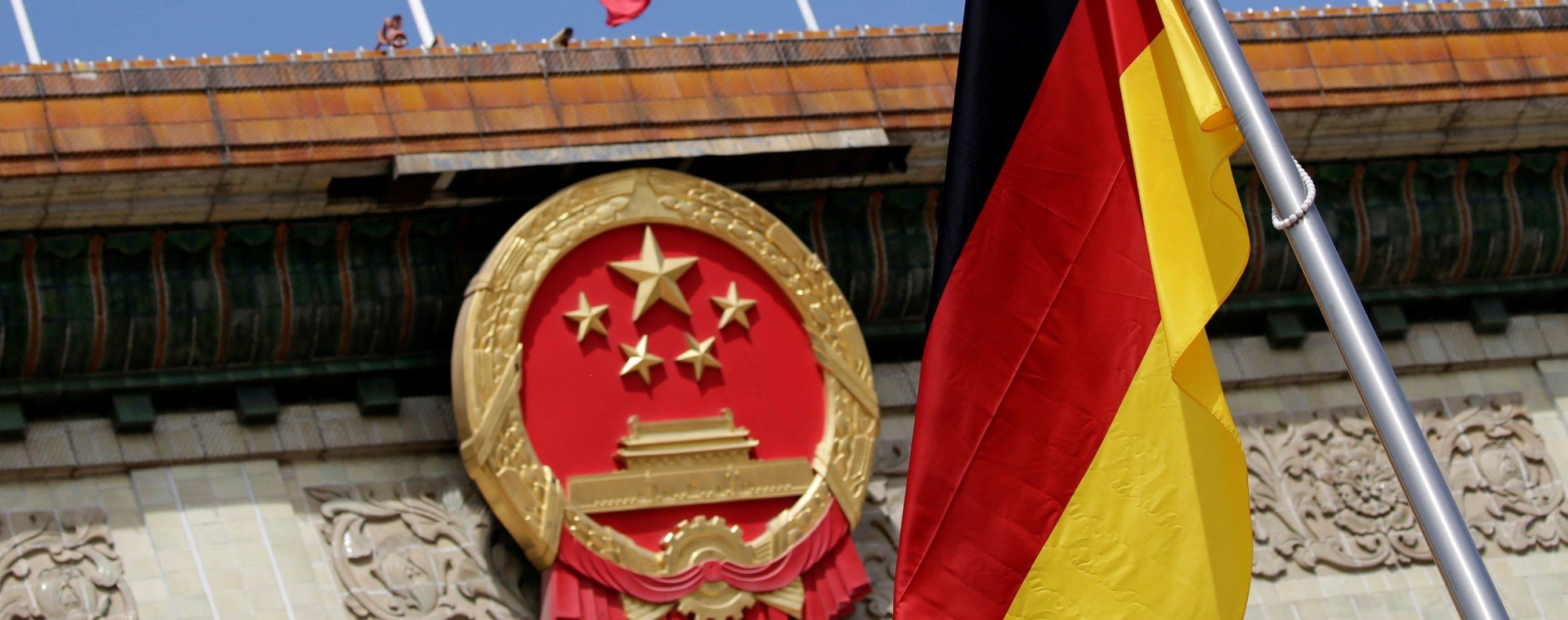 A German flag flutters outside the Great Hall of the People. Photo: Reuters