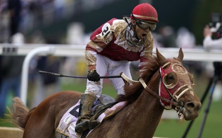 Sonny Leon celebrates after riding Rich Strike past the finish line to win the 148th running of the Kentucky Derby horse race at Churchill Downs in Louisville, Kentucky on Saturday. Photo: AP 