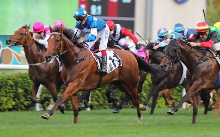 Lucky With You (blue and white silks) storms to victory at Sha Tin last month. Photos: Kenneth Chan
