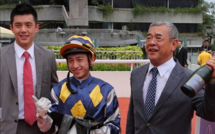Pierre Ng (left) celebrates a winner with his father Peter and jockey Dicky Lui in 2013. Photo: Kenneth Chan