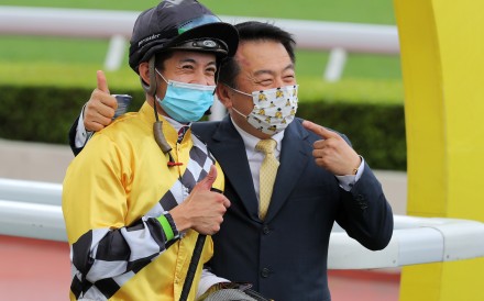 Jockey Derek Leung and trainer Ricky Yiu are all smiles following All Riches’ victory. Photo: Kenneth Chan