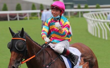 Dylan Mo celebrates the recent win of Super Axiom at Sha Tin. Photo: Kenneth Chan