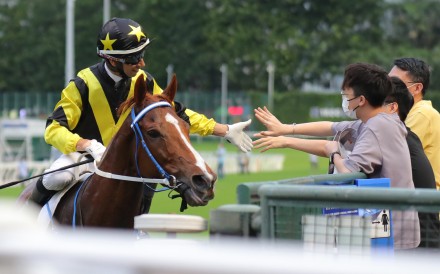 Joao Moreira greets fans after winning aboard Tailor Made at Happy Valley. Photos: Kenneth Chan