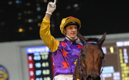 Zac Purton celebrates his record-breaking win at Happy Valley last night. Photos: Kenneth Chan
