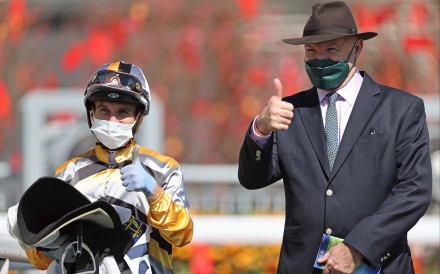 Luke Currie celebrates his first Hong Kong win in January 2022 with Miracle Victory’s trainer, David Hayes. Photo: HKJC