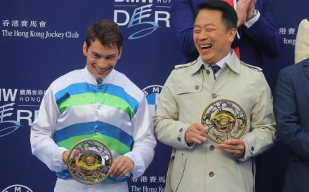 Jockey Alexis Badel and trainer Ricky Yiu receive their Hong Kong Derby trophies following Voyage Bubble’s surprise win in the city’s most prestigious race. Photo: Kenneth Chan