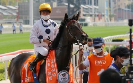 Golden Sixty and Vincent Ho after winning the 2022 Champions Mile. Photo: Kenneth Chan