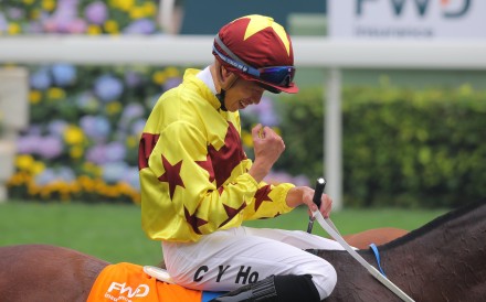 Vincent Ho celebrates after winning the 2020 Champions Mile aboard Southern Legend. Photo: Kenneth Chan