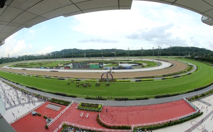 The field crosses the finish line at Kranji. Photos: Kenneth Chan