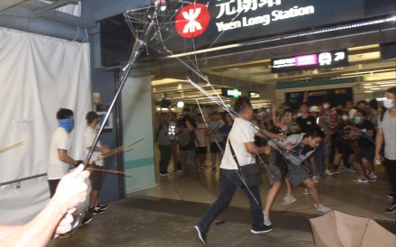 Men in white T-shirts launch an attack at the Yuen Long MTR station during the 2019 social unrest. Photo: Handout