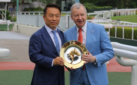 Ricky Yiu celebrates his 1,000th win with Jockey Club CEO Winfried Engelbrecht-Bresges. Photos: Kenneth Chan