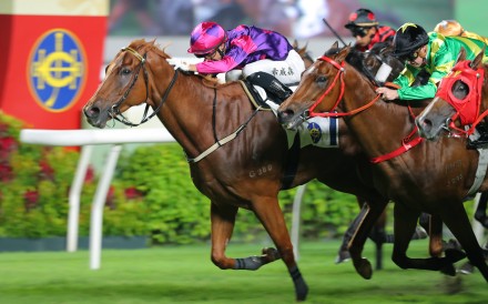 Ching (left) salutes under Lyle Hewitson at Sha Tin on Monday. Photo: Kenneth Chan