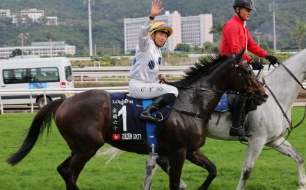 Vincent Ho waves to the Sha Tin crowd after winning the Hong Kong Mile on Golden Sixty last December. Photos: Kenneth Chan