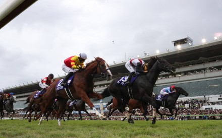 Lugal (red and white colours) wins Sunday’s Sprinters Stakes at Nakayama racecourse. Photo: JRA