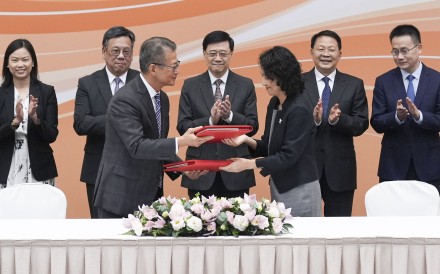 Hong Kong Financial Secretary Paul Chan Mo-po (front, left) and China’s Minister of Commerce, Li Yongjie (front, right), during the signing of an amendment to the Closer Economic Partnership Arrangement (CEPA). Photo: Eugene Lee