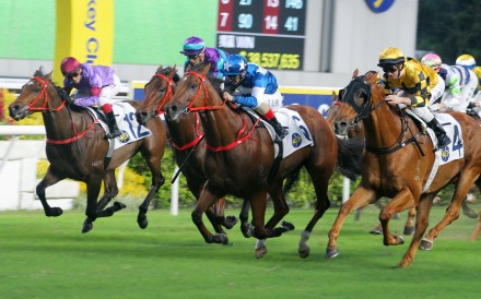 Lucky With You (centre) storms home to win under Andrea Atzeni last year. Photos: Kenneth Chan