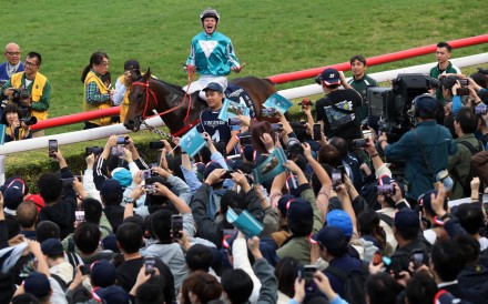 James McDonald revs up the crowd after Romantic Warrior’s record win in Sunday’s Hong Kong Cup at Sha Tin. Photos: Kenneth Chan