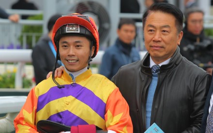 Jockey Matthew Poon and trainer Ricky Yiu enjoy Straight Arron’s recent Group Two success. Photo: Kenneth Chan