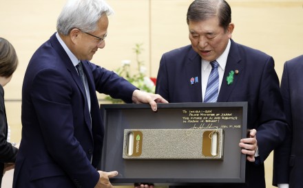 Japanese Prime Minister Shigeru Ishiba, right, receives a gift from Nvidia chief executive Jensen Huang at the start of their meeting in Tokyo on April 21, 2025. Photo: EPA-EFE