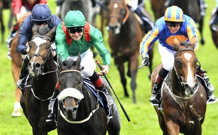 Harzand (centre) wins the 2016 Epsom Derby for the Aga Khan. Photo: EPA
