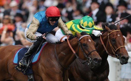 Lazzat (red cap) and James Doyle get the better of Satono Reve. Photo: Reuters