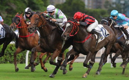 Light Years Charm (white and purple cap) fends off Mickley (red and black) in a tight finish at Sha Tin. Photos: Kenneth Chan