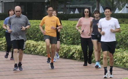 A group of Hong Kong residents jogging in Central. Photo: Jonathan Wong