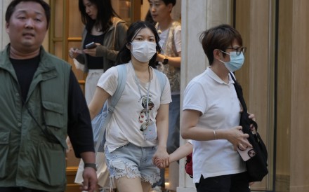 People wearing masks for protection in Tsim Sha Tsui on May 15 after the city’s health authorities announced they had recorded 30 Covid-19-related deaths among 81 severe adult cases in four weeks. Photo: May Tse