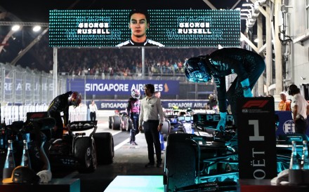 Mercedes’ George Russell climbs out of his car after winning the Singapore Grand Prix. Photo: Reuters