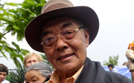 Kanchha Sherpa, a member of the expedition team that placed Tenzing Norgay and Edmund Hillary on the summit of the world’s highest mountain, gestures during a celebration in Kathmandu in 2013. Photo: AFP