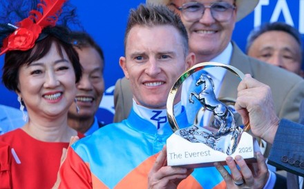 Jockey Zac Purton with his The Everest trophy. Photo: HKJC