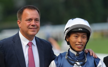 Trainer Caspar Fownes and jockey Vincent Ho are all smiles after Alpha Strike’s victory. Photos: Kenneth Chan