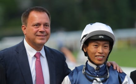 Trainer Caspar Fownes and jockey Vincent Ho are all smiles after Alpha Strike’s victory. Photos: Kenneth Chan