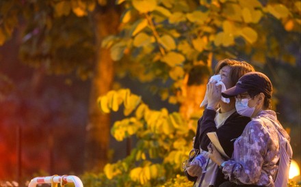 Relatives weep after identifying their deceased loved ones. Photo: Sam Tsang