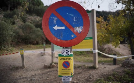 A warning sign reading ‘African Swine Fever Surveillance Zone’, near Barcelona. Photo: AFP