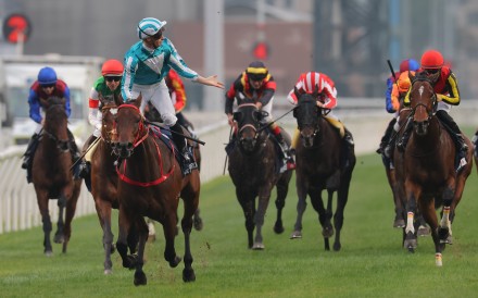 James McDonald laps it up as Romantic Warrior secures a third Hong Kong Cup success. Photo: Kenneth Chan