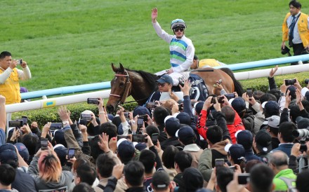 Jockey Zac Purton salutes the Sha Tin crowd after booting home Voyage Bubble in the Group One Hong Kong Sprint. Photos: Kenneth Chan