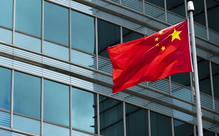 A national flag flies outside the Commissioner’s Office of China’s Foreign Ministry in Hong Kong. Photo: Warton Li