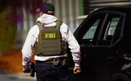 Law enforcement agents take part in the search for the Brown University shooter in Salem, New Hampshire, on Thursday. Photo: Reuters
