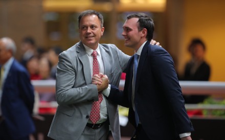 Caspar Fownes celebrates a Happy Valley win with son Ronan. Photos: Kenneth Chan