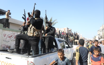Palestinian armed fighters in Gaza during the handover of Israeli captives in October last year. Photo: dpa