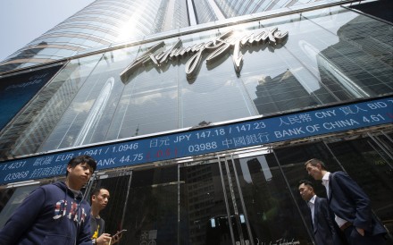 People walk past Exchange Square in Central, home of bourse operator Hong Kong Exchanges and Clearing. Photo: Nathan Tsui