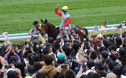 Jockey Zac Purton celebrates Ka Ying Rising’s Hong Kong Sprint success with fans at Sha Tin. Photos: Kenneth Chan