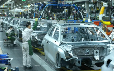 Volkswagen workers seen at an assembly line in the German carmaker’s plant in Qingdao, in eastern Shandong province, on December 23, 2025. Photo: AFP