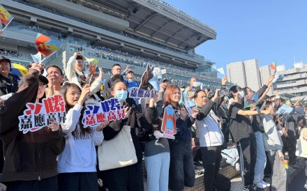 
                                Fans gathered for the sixth race of the day, holding up homemade banners, paintings and flags in support. Photo: Stephy Zhang